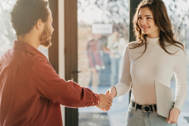 OPT Blog Image - People talking to each other at a trade booth