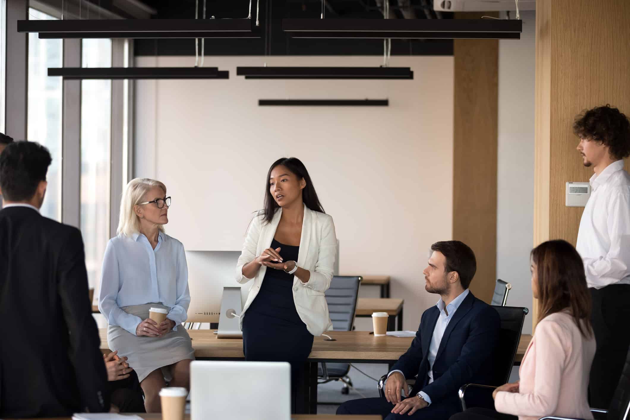 Corporate team discussing ways to improve brand reputation.