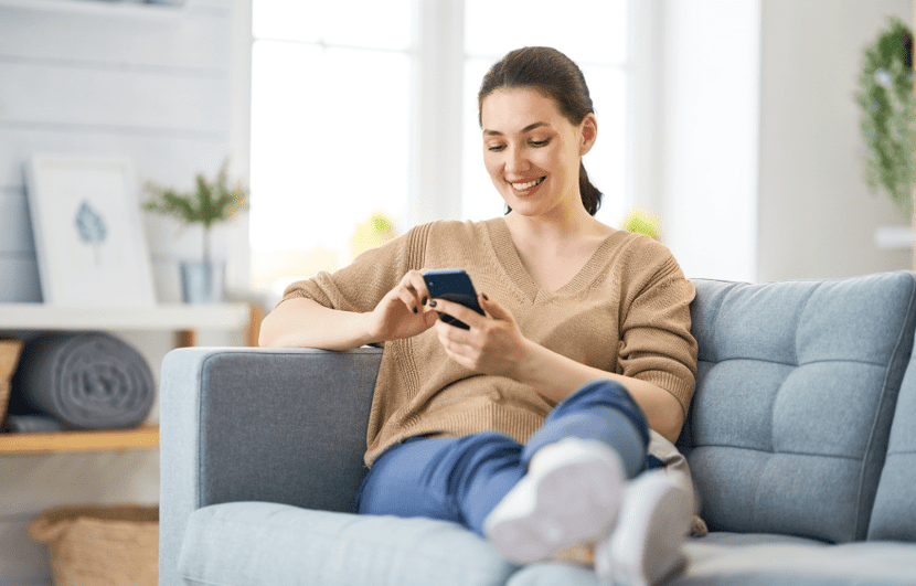 Happy woman getting starbucks gift card emailed.