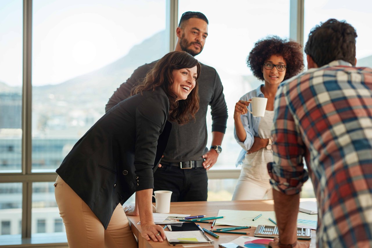 OPT Blog Image - Employees discussing the designs of their brand without a physical product at hand