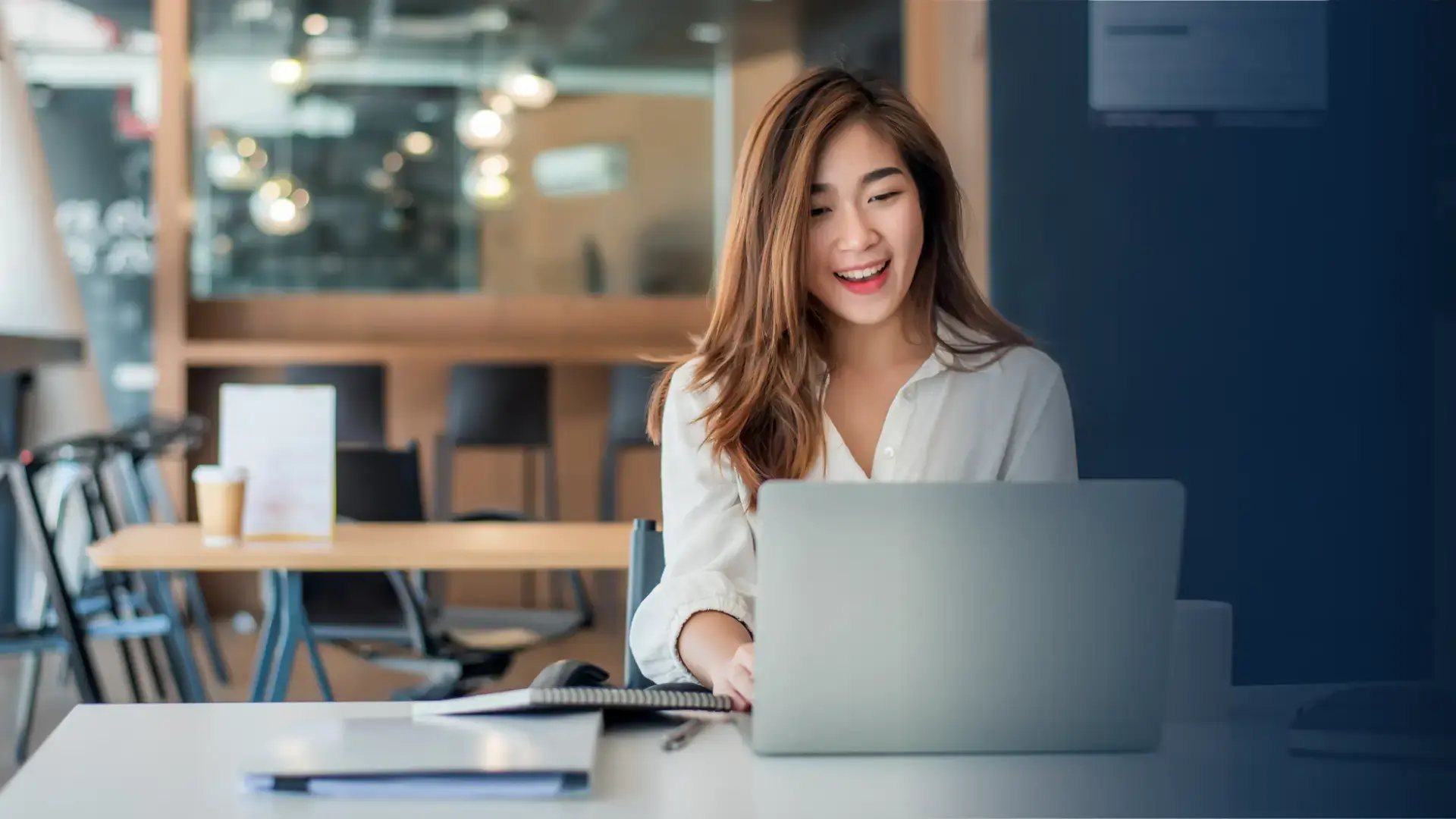 female incentive program manager in office using laptop